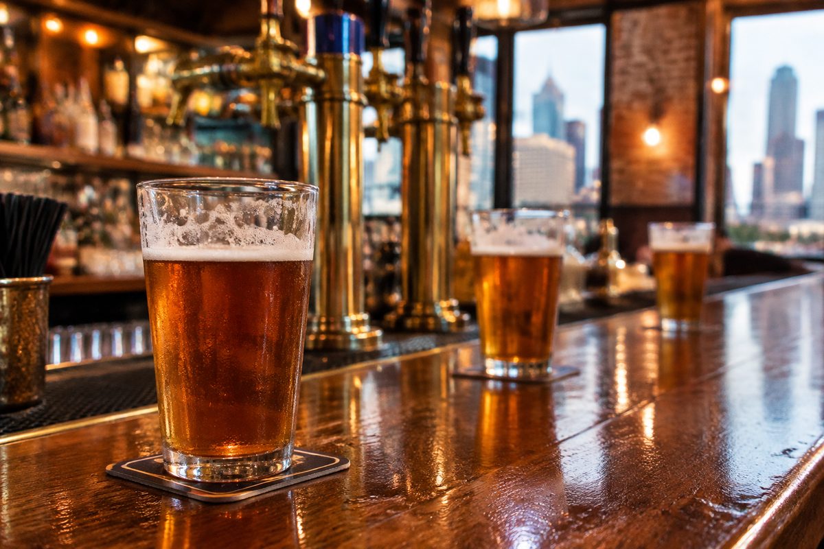Houston sports taproom bar counter with cold craft draft beer pints